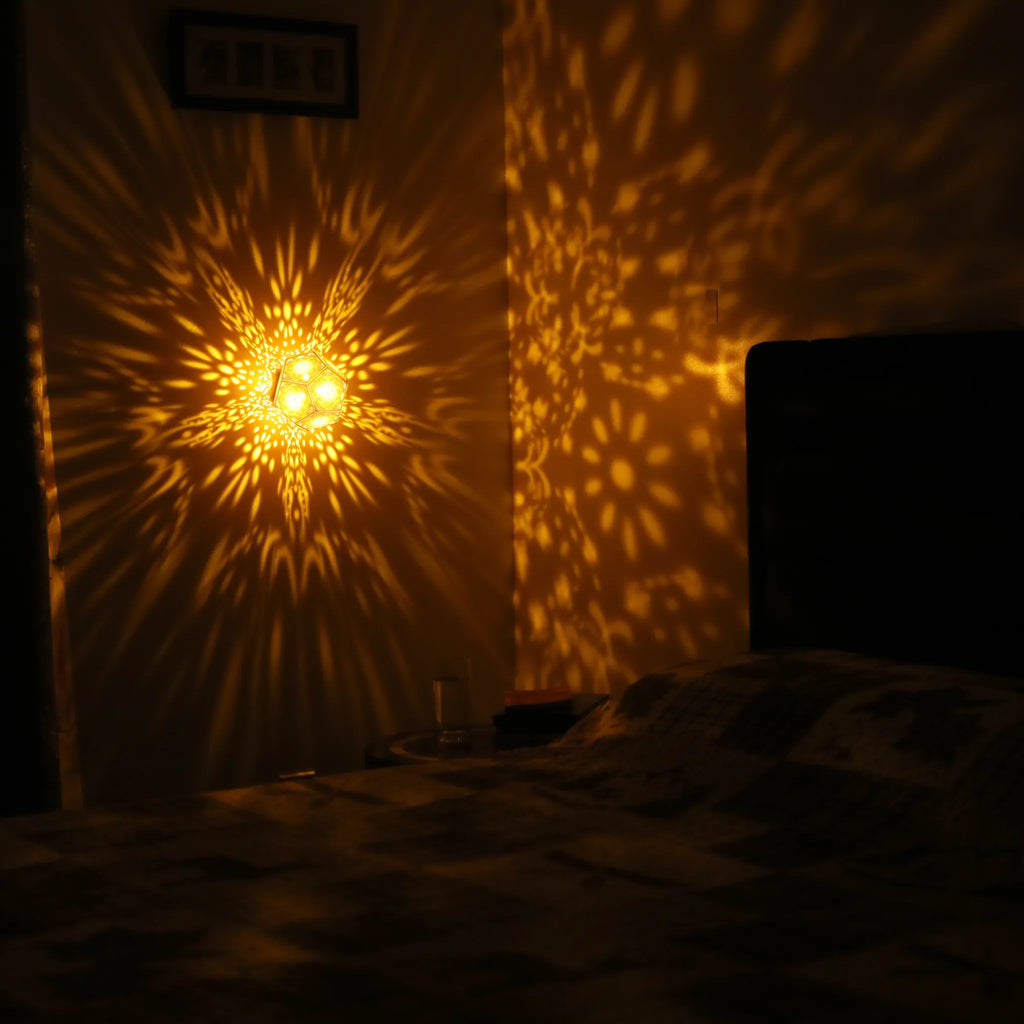 MikhaLuma Logos dodecahedron lantern in Amber style, warm amber light wrapping a wall corner