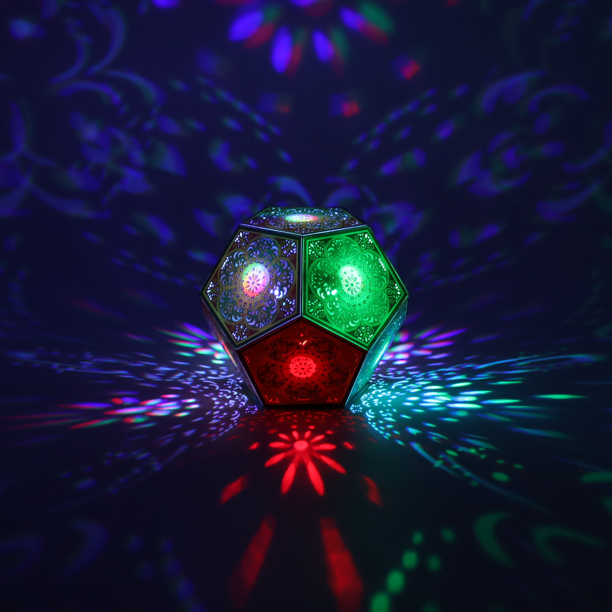 MikhaLuma Logos dodecahedron lantern in Shadow Caster style, casting geometric light patterns across a dark room