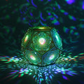 MikhaLuma Logos dodecahedron lantern in Shadow Caster style, casting geometric light patterns across a dark room