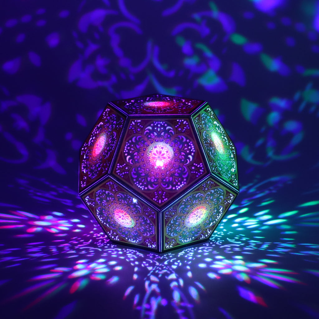 MikhaLuma Logos dodecahedron lantern in Shadow Caster style, casting geometric light patterns across a dark room