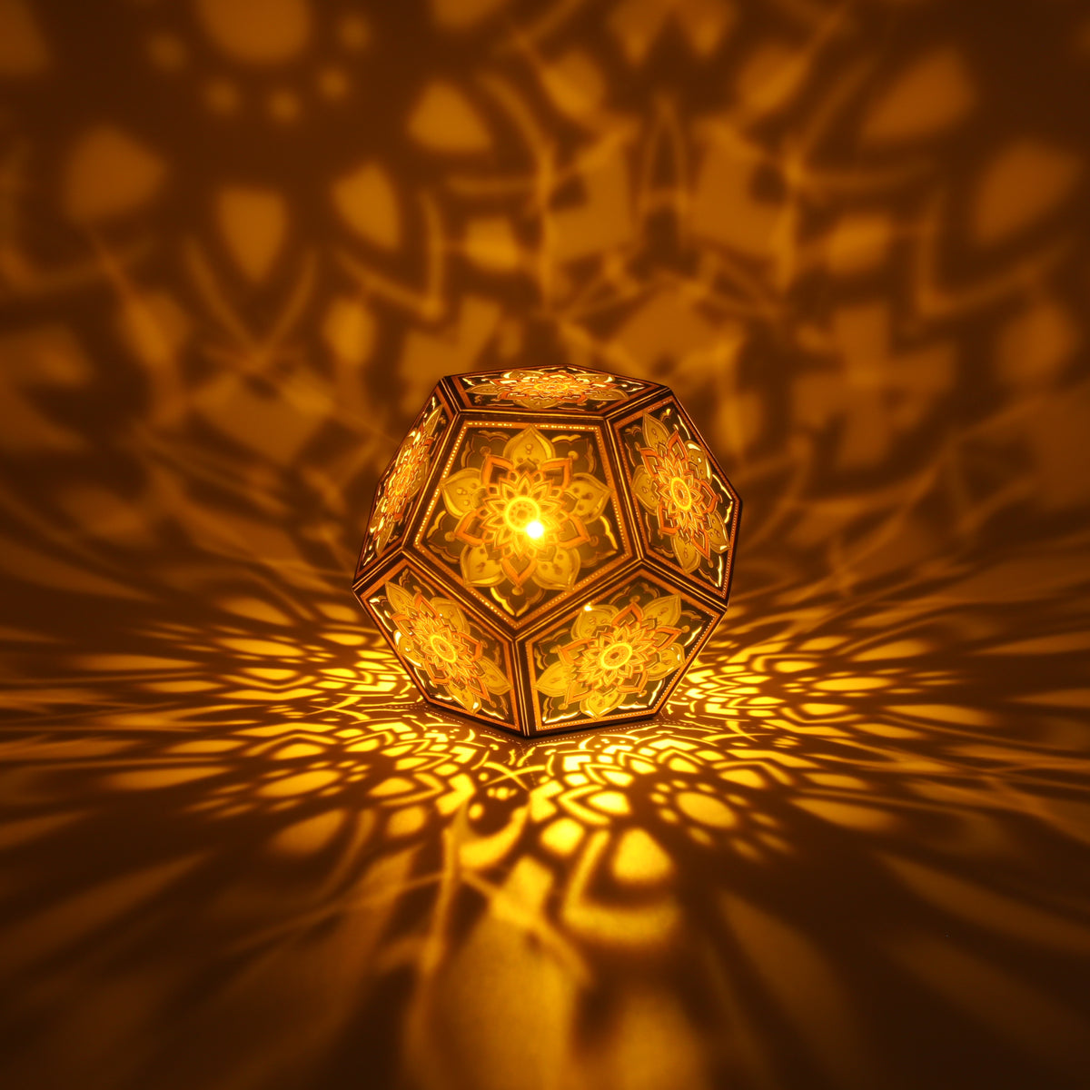 MikhaLuma Telos dodecahedron lantern in Amber style, lit with a warm amber tone