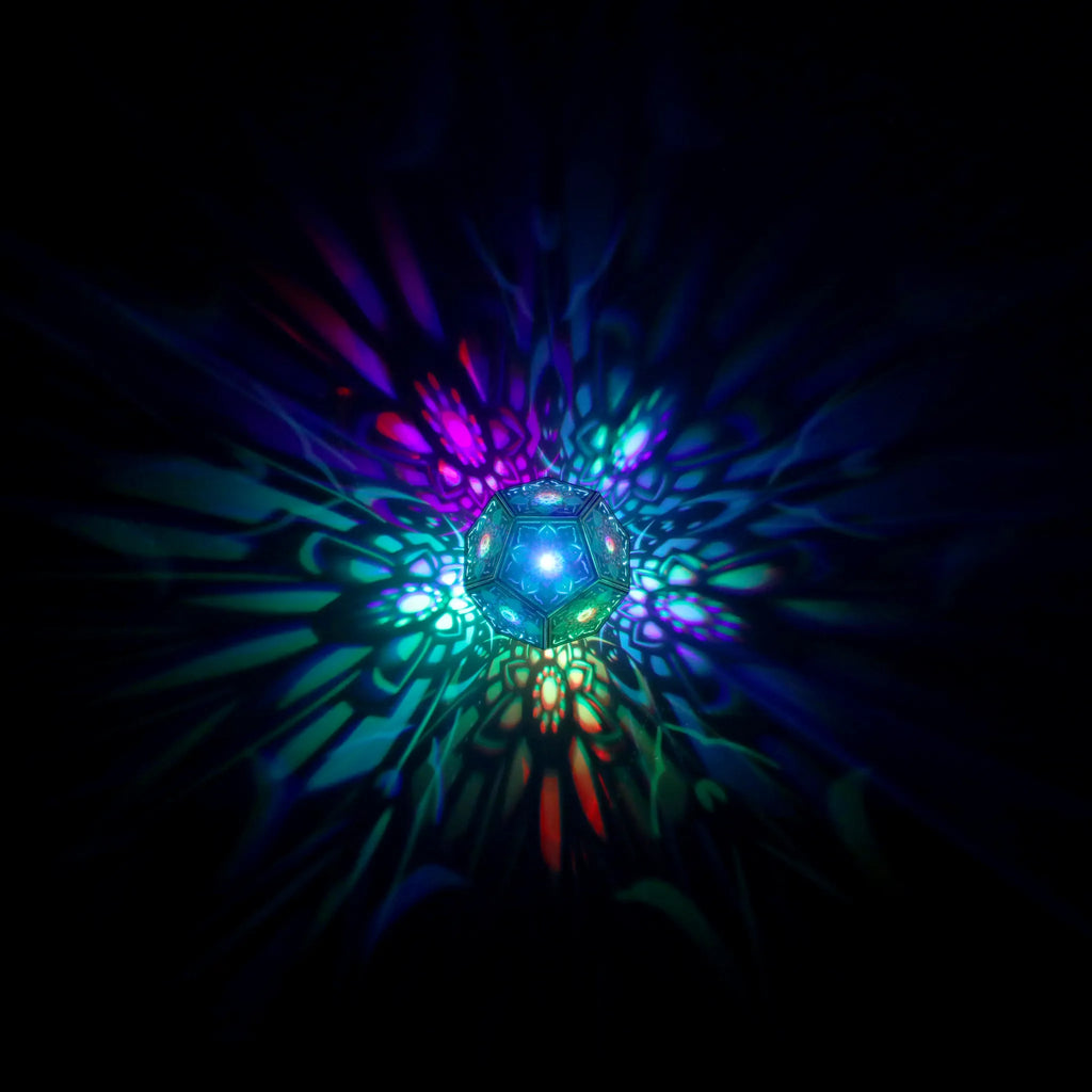 MikhaLuma Telos dodecahedron lantern in Shadow Caster style, geometric pattern projected across a wall