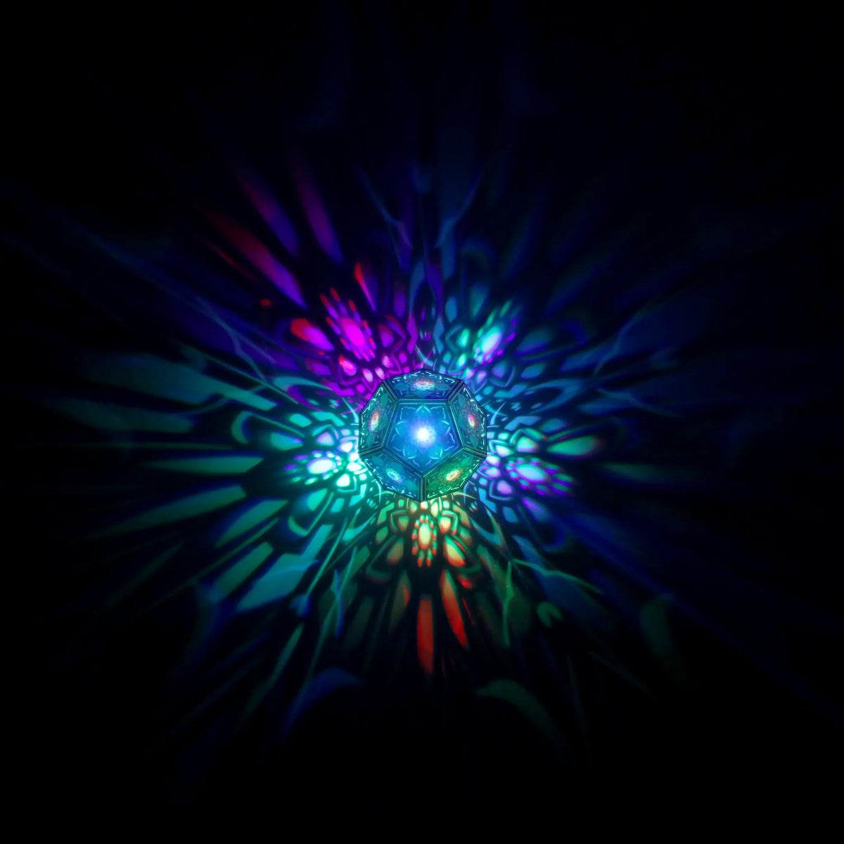 MikhaLuma Telos dodecahedron lantern in Shadow Caster style, geometric pattern projected across a wall