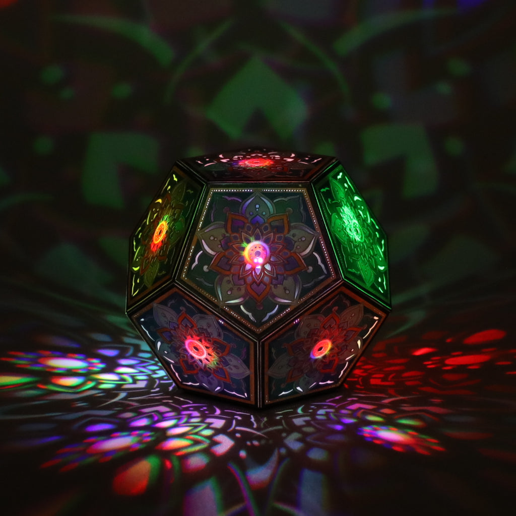 MikhaLuma Telos dodecahedron lantern in Shadow Caster style, casting geometric light patterns across a dark room