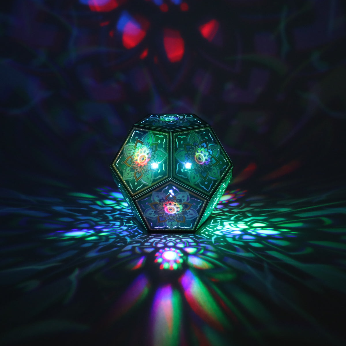 MikhaLuma Telos dodecahedron lantern in Shadow Caster style, casting geometric light patterns across a dark room