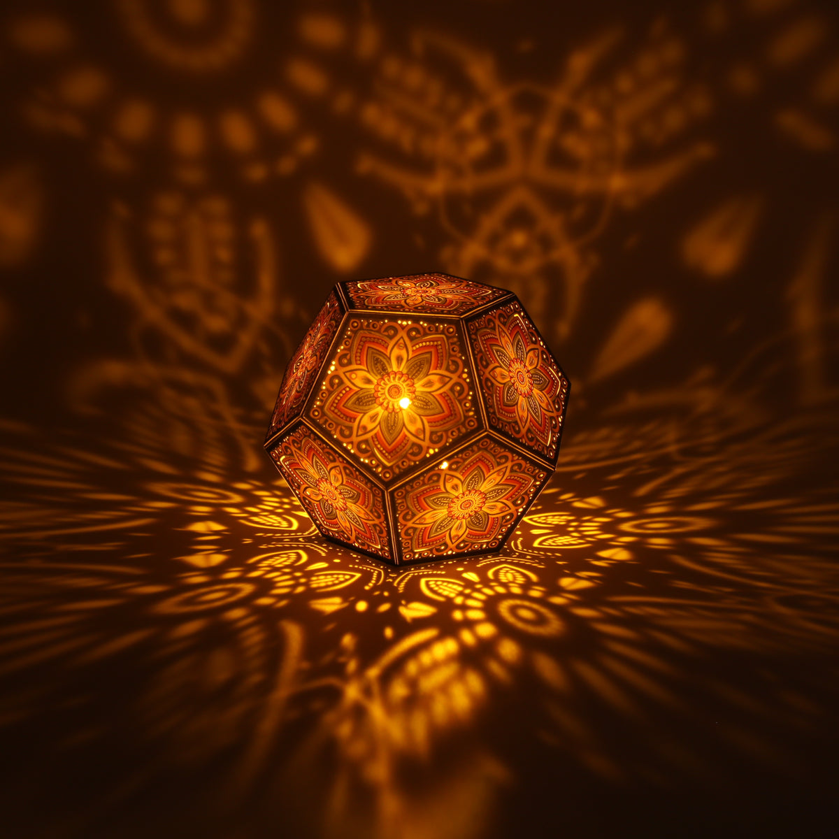 MikhaLuma Xenia dodecahedron lantern in Amber style, lit with a warm amber tone