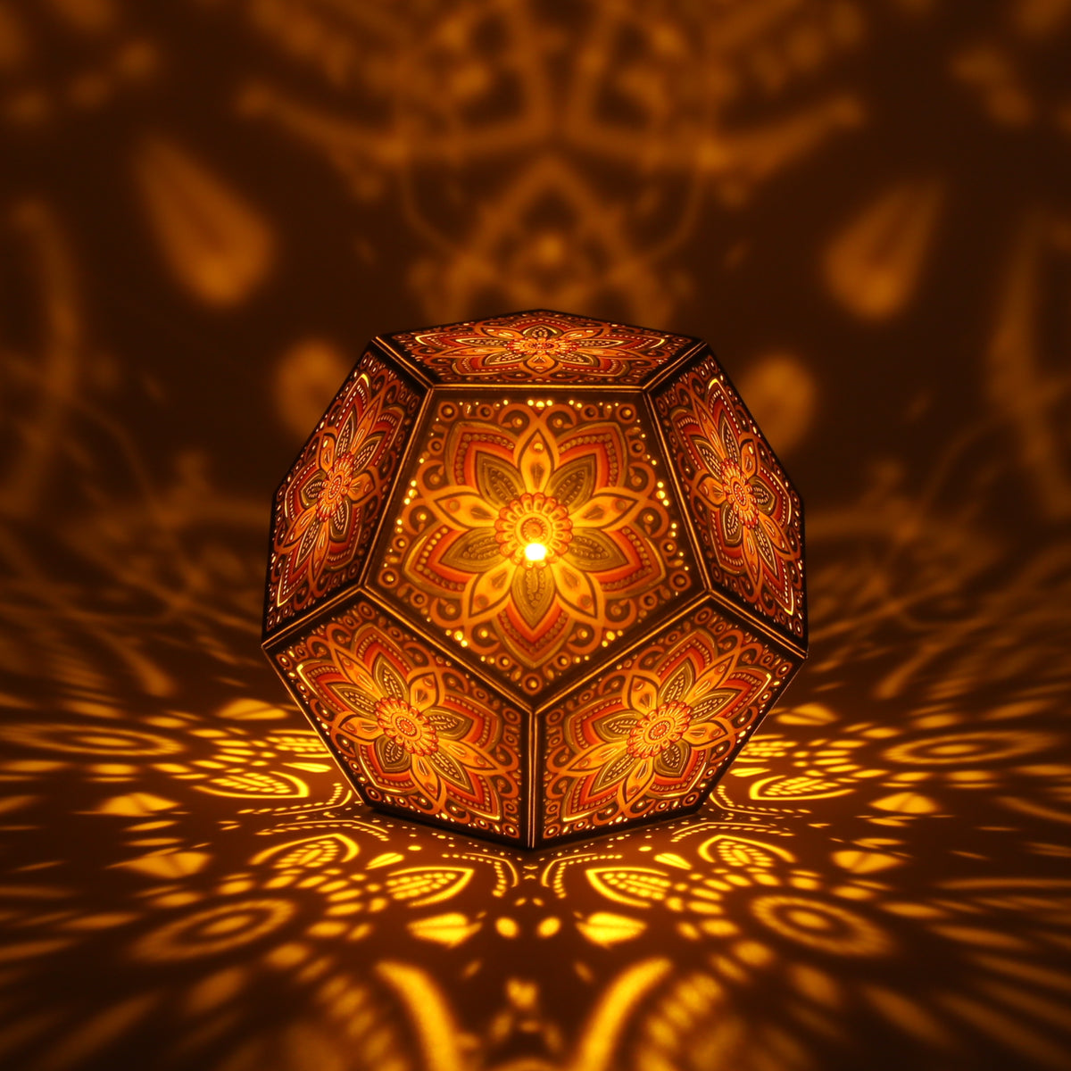 MikhaLuma Xenia dodecahedron lantern in Amber style, lit with a warm amber tone