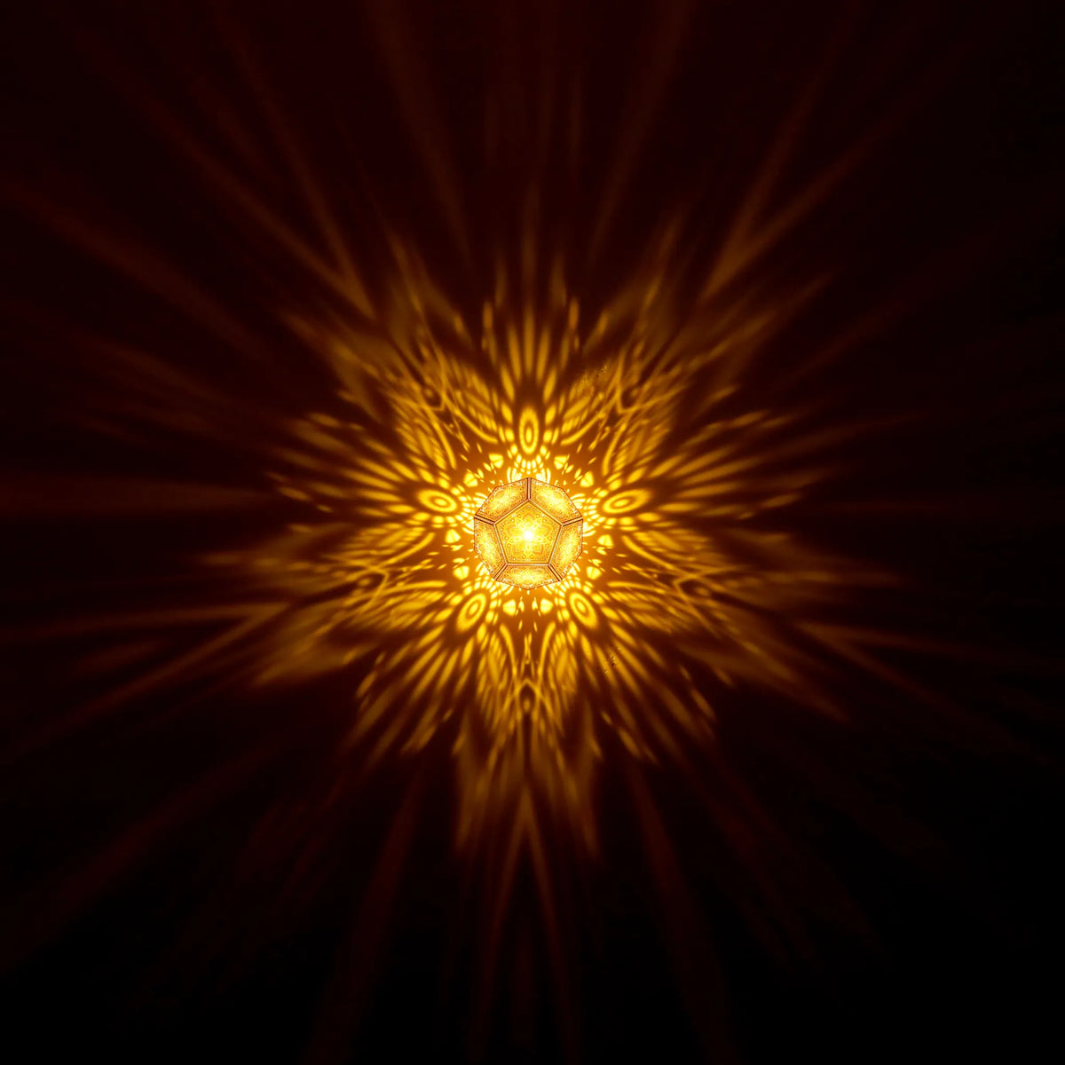 MikhaLuma Xenia dodecahedron lantern in Amber style, warm amber light washing a wall