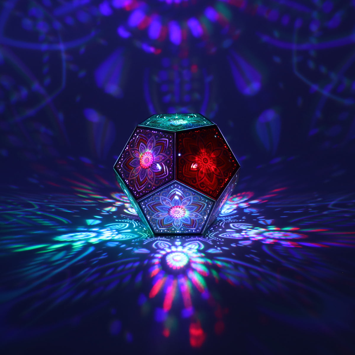MikhaLuma Xenia dodecahedron lantern in Shadow Caster style, casting geometric light patterns across a dark room