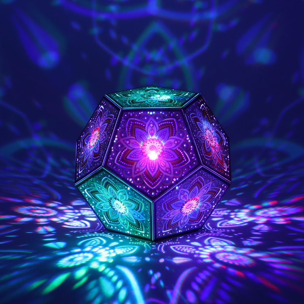 MikhaLuma Xenia dodecahedron lantern in Shadow Caster style, casting geometric light patterns across a dark room