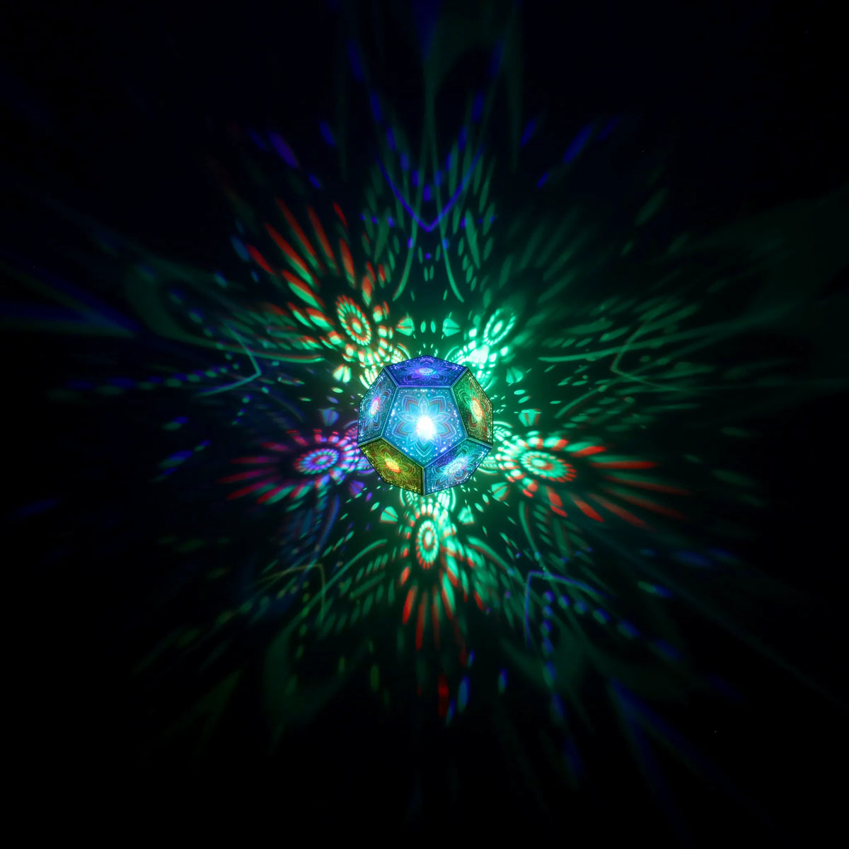 MikhaLuma Xenia dodecahedron lantern in Shadow Caster style, geometric pattern projected across a wall