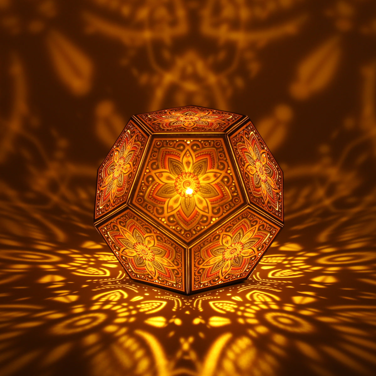 MikhaLuma Storge dodecahedron lantern in Amber style, lit with a warm amber tone