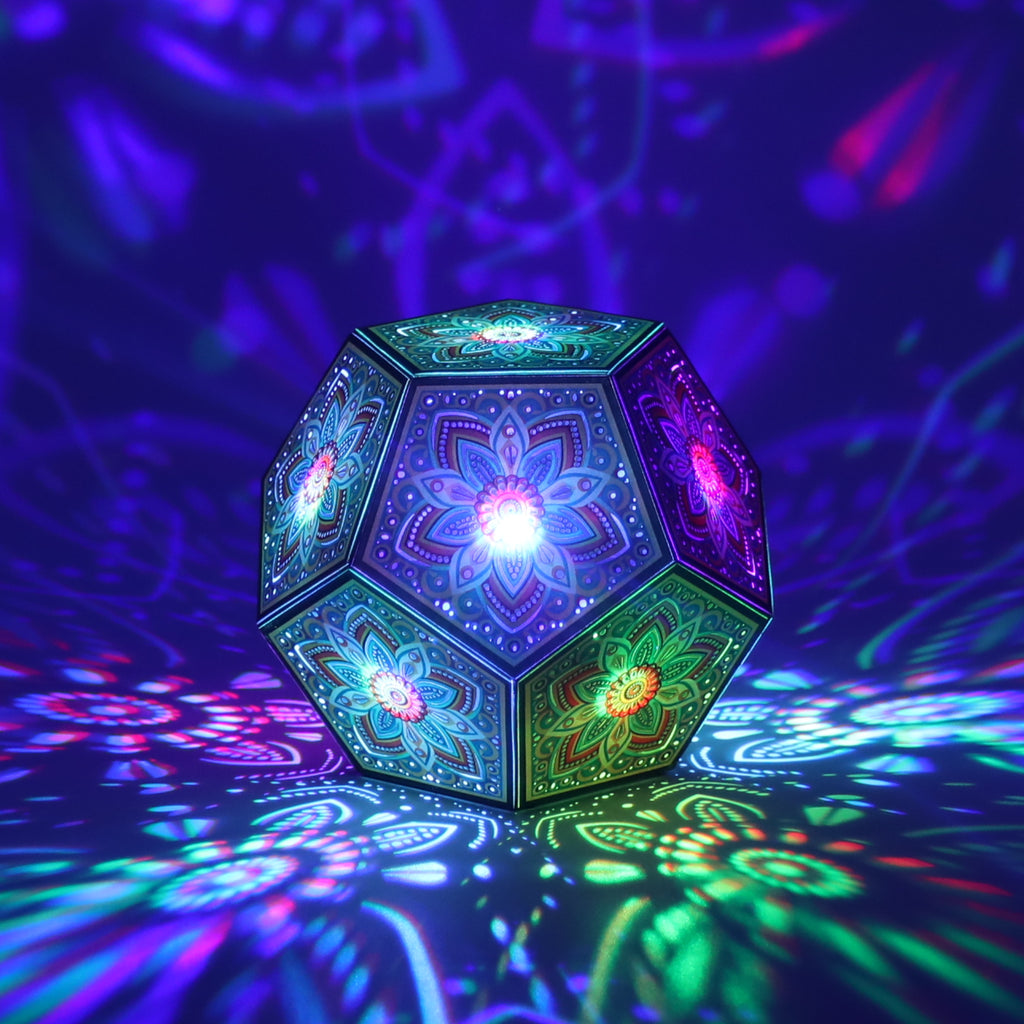 MikhaLuma Storge dodecahedron lantern in Shadow Caster style, casting geometric light patterns across a dark room