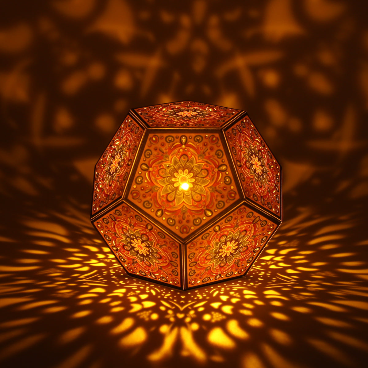 MikhaLuma Eunoia dodecahedron lantern in Amber style, lit with a warm amber tone