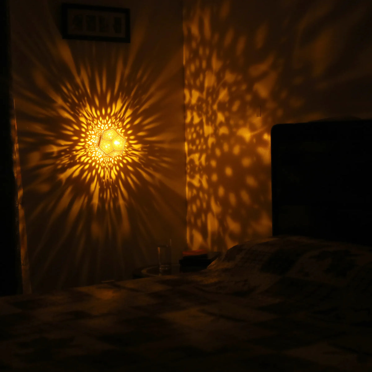 MikhaLuma Eunoia dodecahedron lantern in Amber style, warm amber light wrapping a wall corner