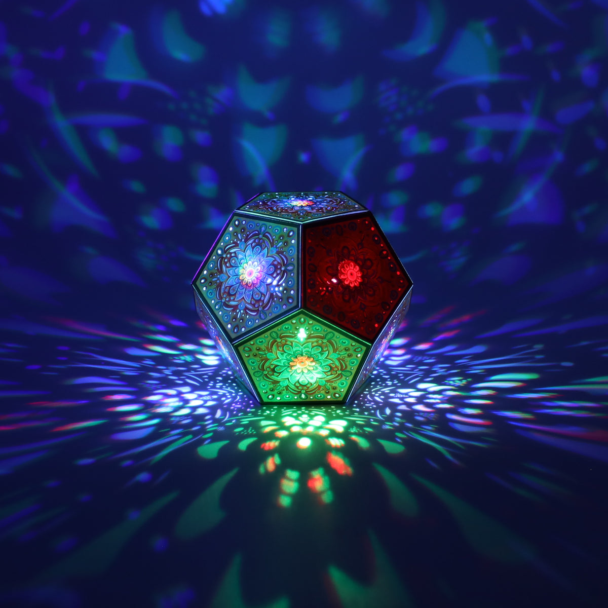 MikhaLuma Eunoia dodecahedron lantern in Shadow Caster style, casting geometric light patterns across a dark room