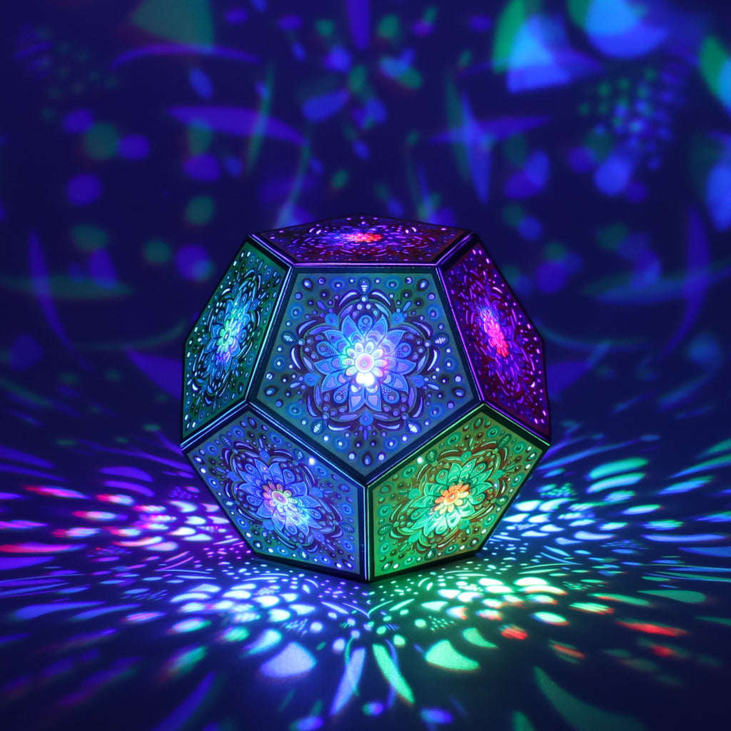 MikhaLuma Eunoia dodecahedron lantern in Shadow Caster style, casting geometric light patterns across a dark room