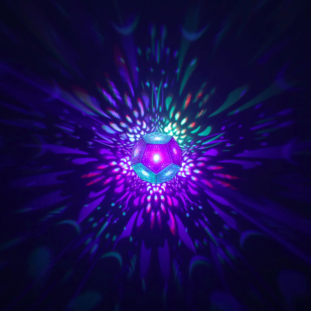 MikhaLuma Eunoia dodecahedron lantern in Shadow Caster style, geometric pattern projected across a wall
