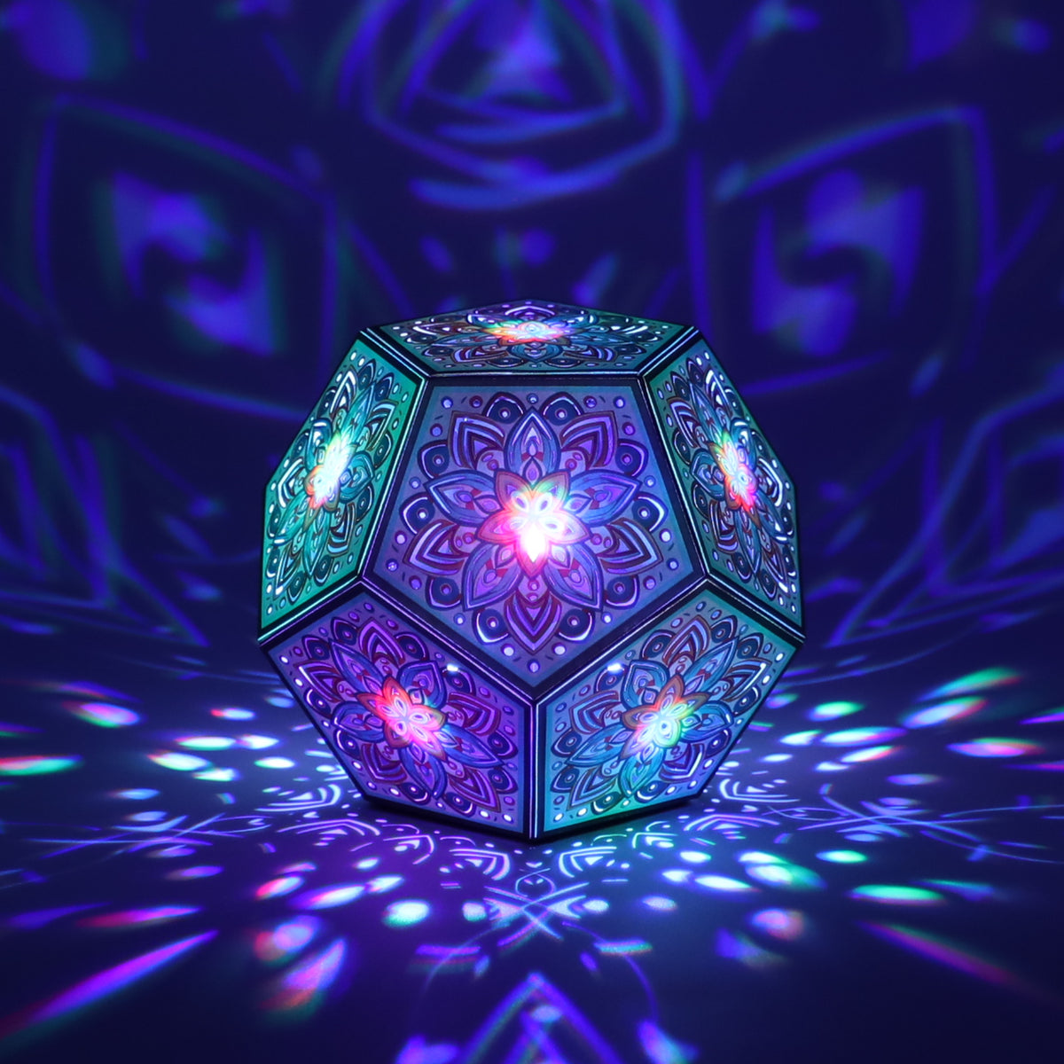 MikhaLuma Philia dodecahedron lantern in Shadow Caster style, casting geometric light patterns across a dark room