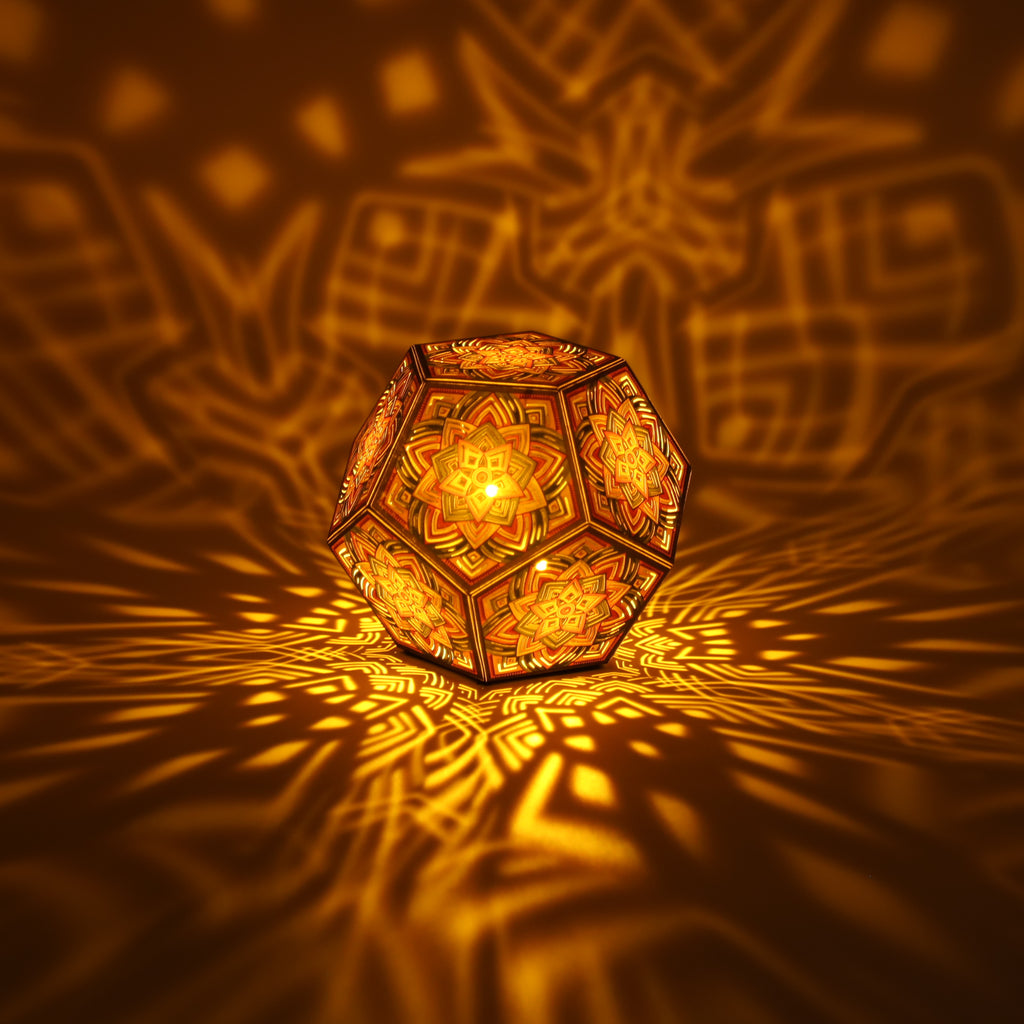 MikhaLuma Arete dodecahedron lantern in Amber style, lit with a warm amber tone