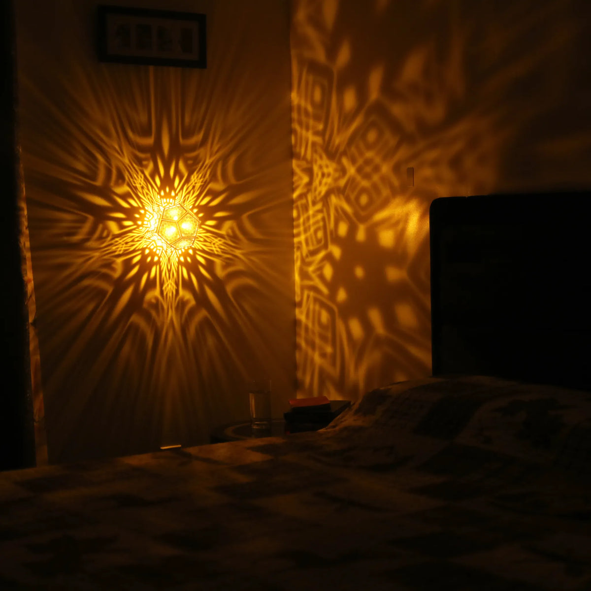 MikhaLuma Arete dodecahedron lantern in Amber style, warm amber light wrapping a wall corner