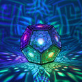 MikhaLuma Arete dodecahedron lantern in Shadow Caster style, casting geometric light patterns across a dark room