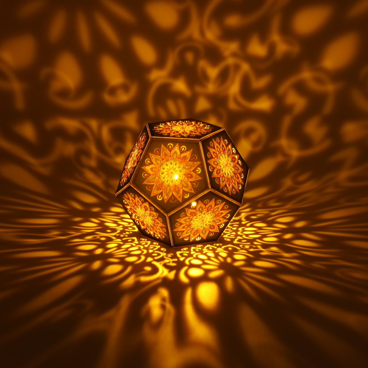 MikhaLuma Episteme dodecahedron lantern in Amber style, lit with a warm amber tone