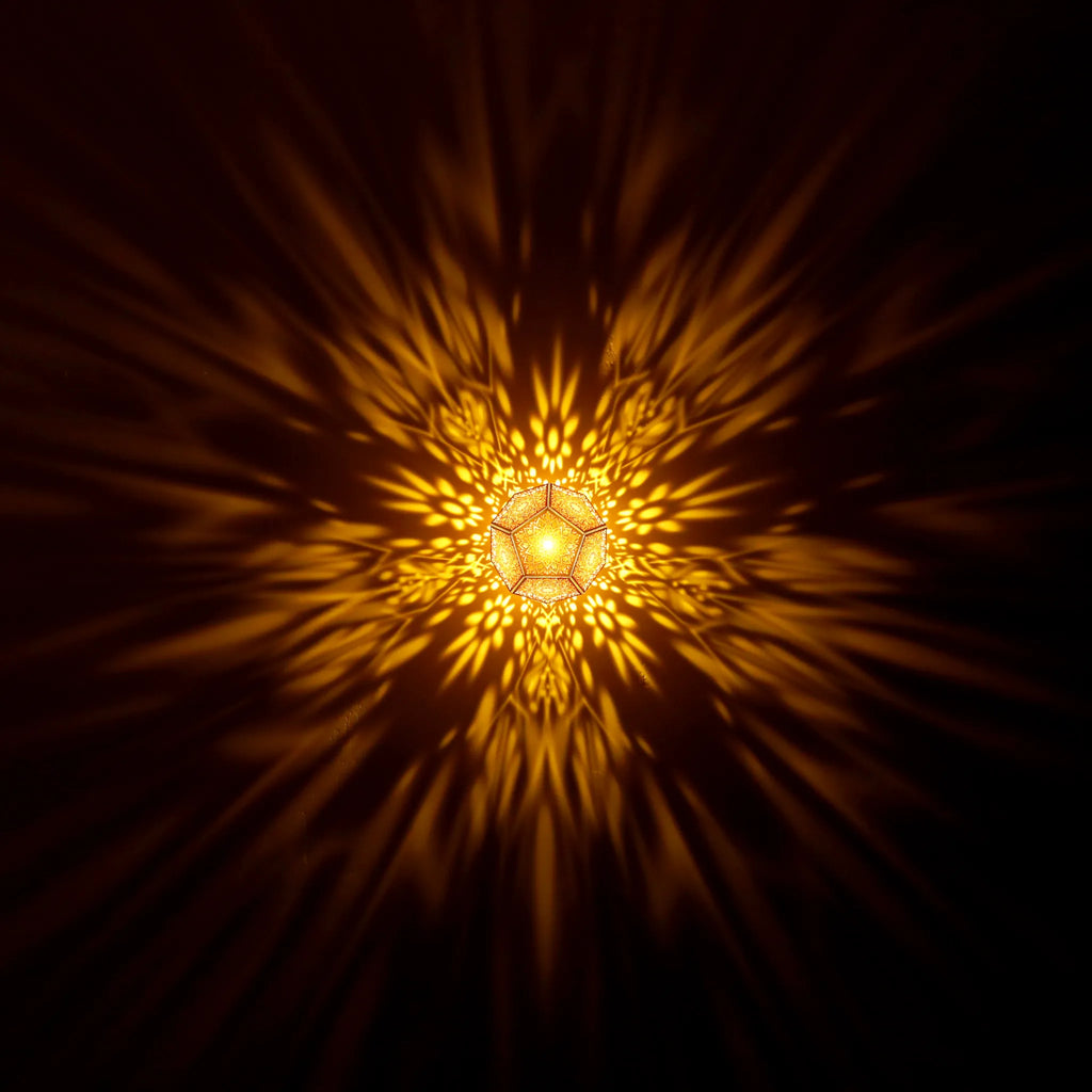 MikhaLuma Eudaimonia dodecahedron lantern in Amber style, warm amber light washing a wall