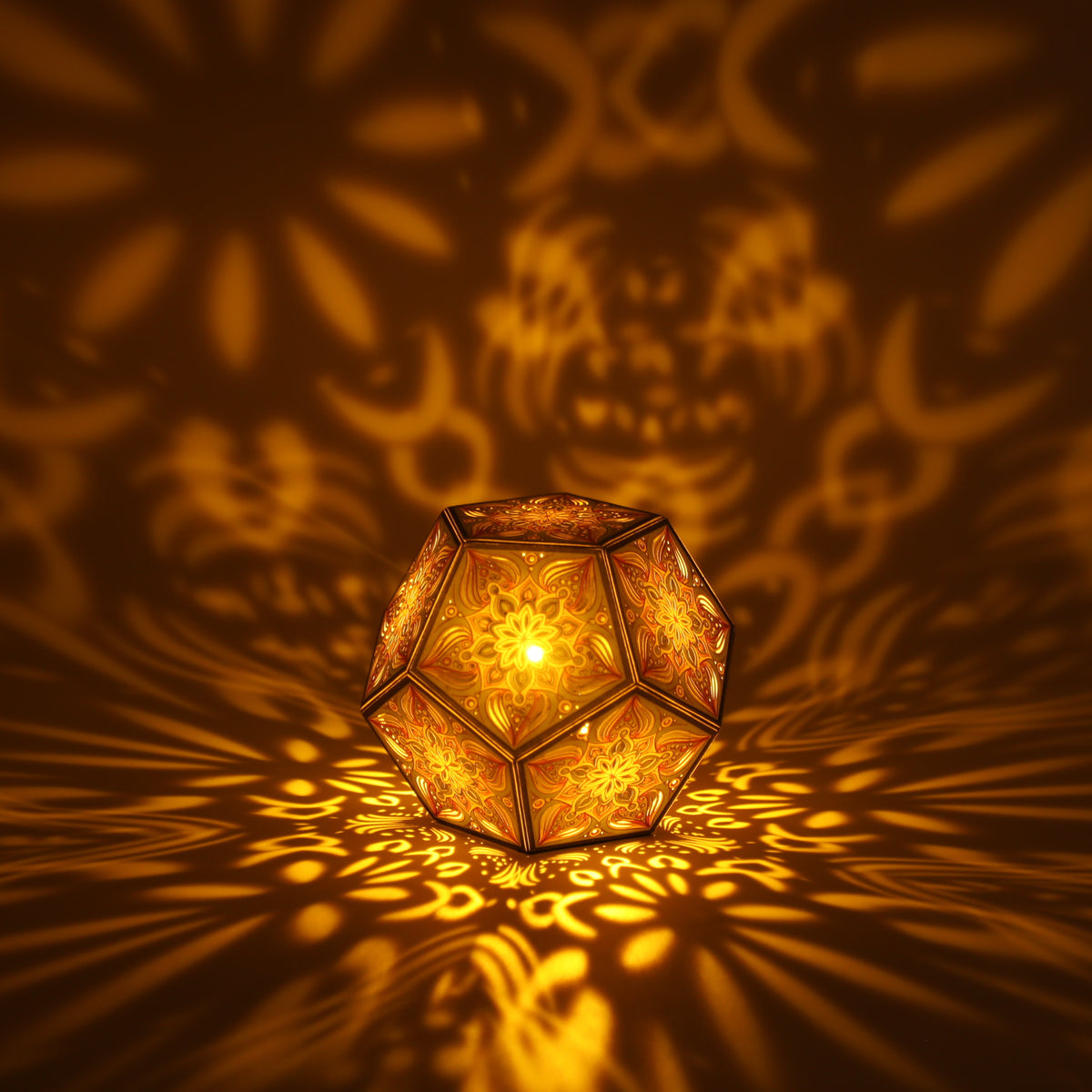 MikhaLuma Ataraxia dodecahedron lantern in Amber style, lit with a warm amber tone
