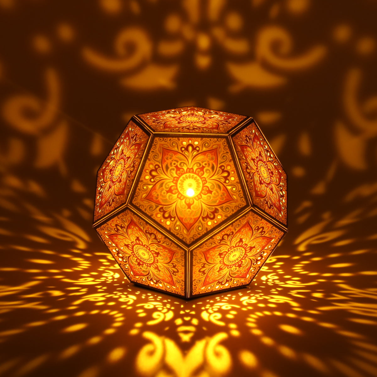 MikhaLuma Aletheia dodecahedron lantern in Amber style, lit with a warm amber tone