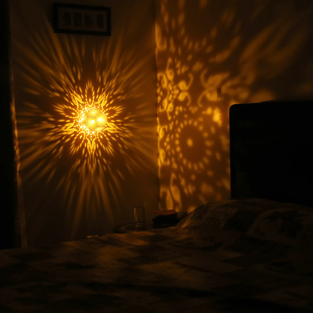 MikhaLuma Aletheia dodecahedron lantern in Amber style, warm amber light wrapping a wall corner