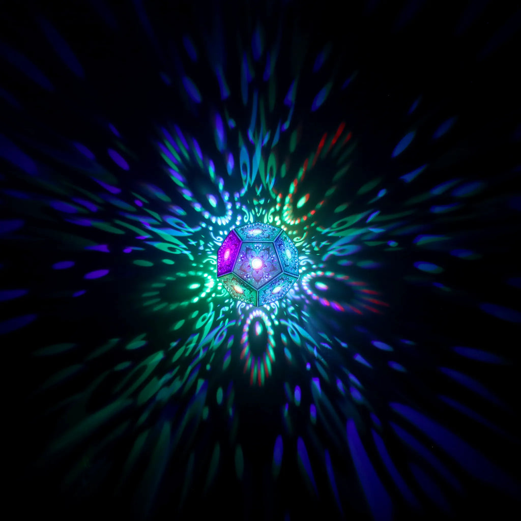 MikhaLuma Aletheia dodecahedron lantern in Shadow Caster style, geometric pattern projected across a wall