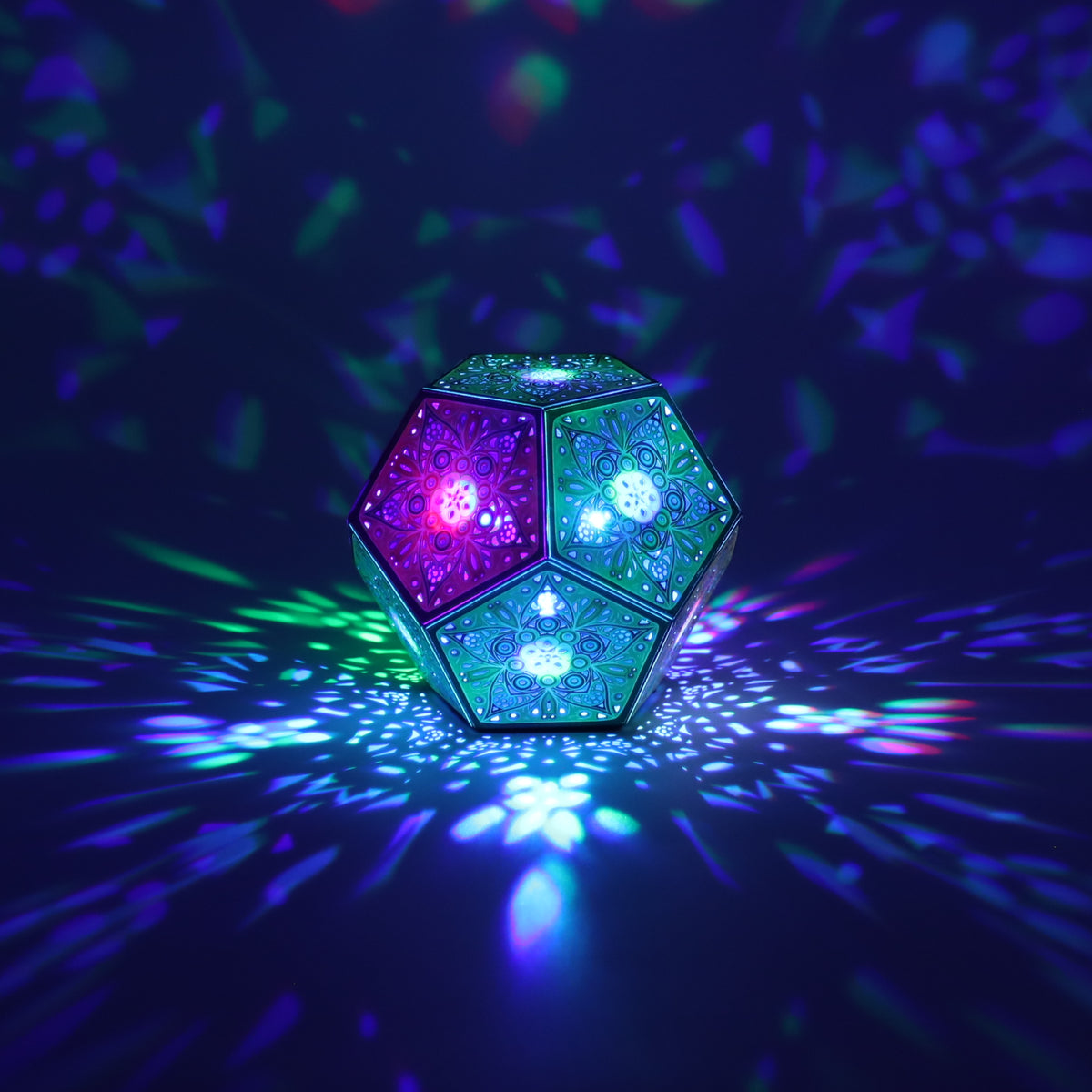 MikhaLuma Phronesis dodecahedron lantern in Shadow Caster style, casting geometric light patterns across a dark room