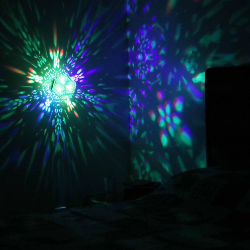 MikhaLuma Phronesis dodecahedron lantern in Shadow Caster style, projected pattern wrapping a wall corner