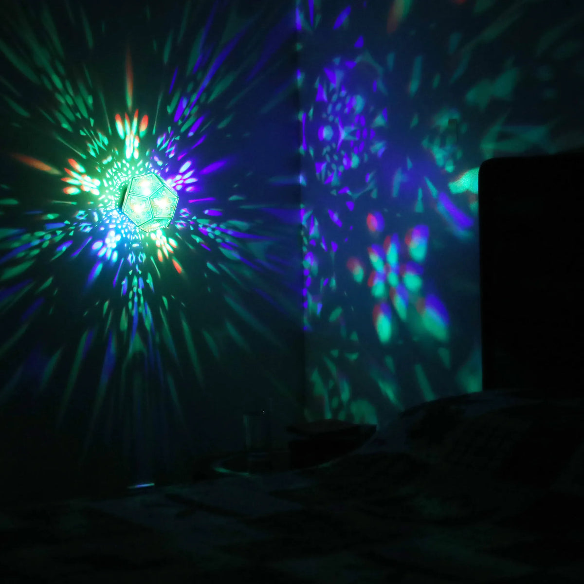 MikhaLuma Phronesis dodecahedron lantern in Shadow Caster style, projected pattern wrapping a wall corner