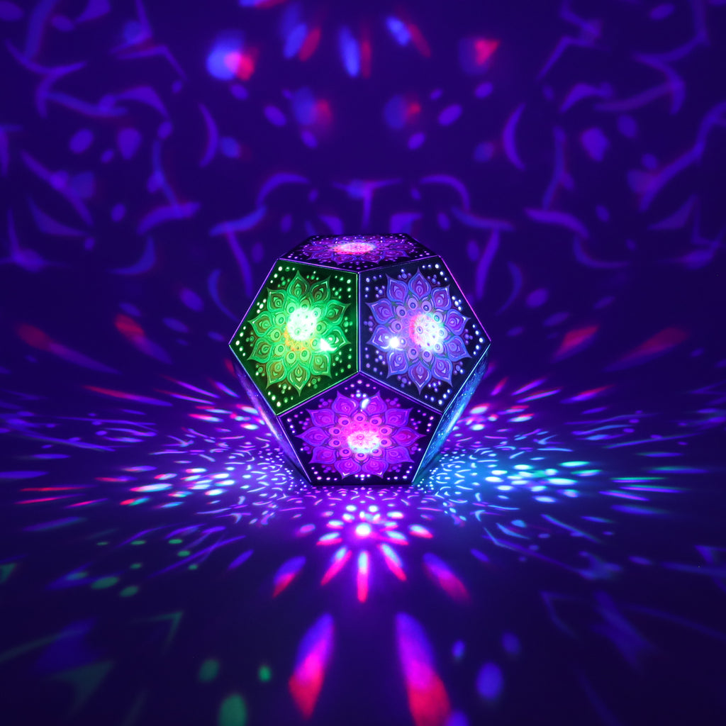 MikhaLuma Oneiros dodecahedron lantern in Shadow Caster style, casting geometric light patterns across a dark room