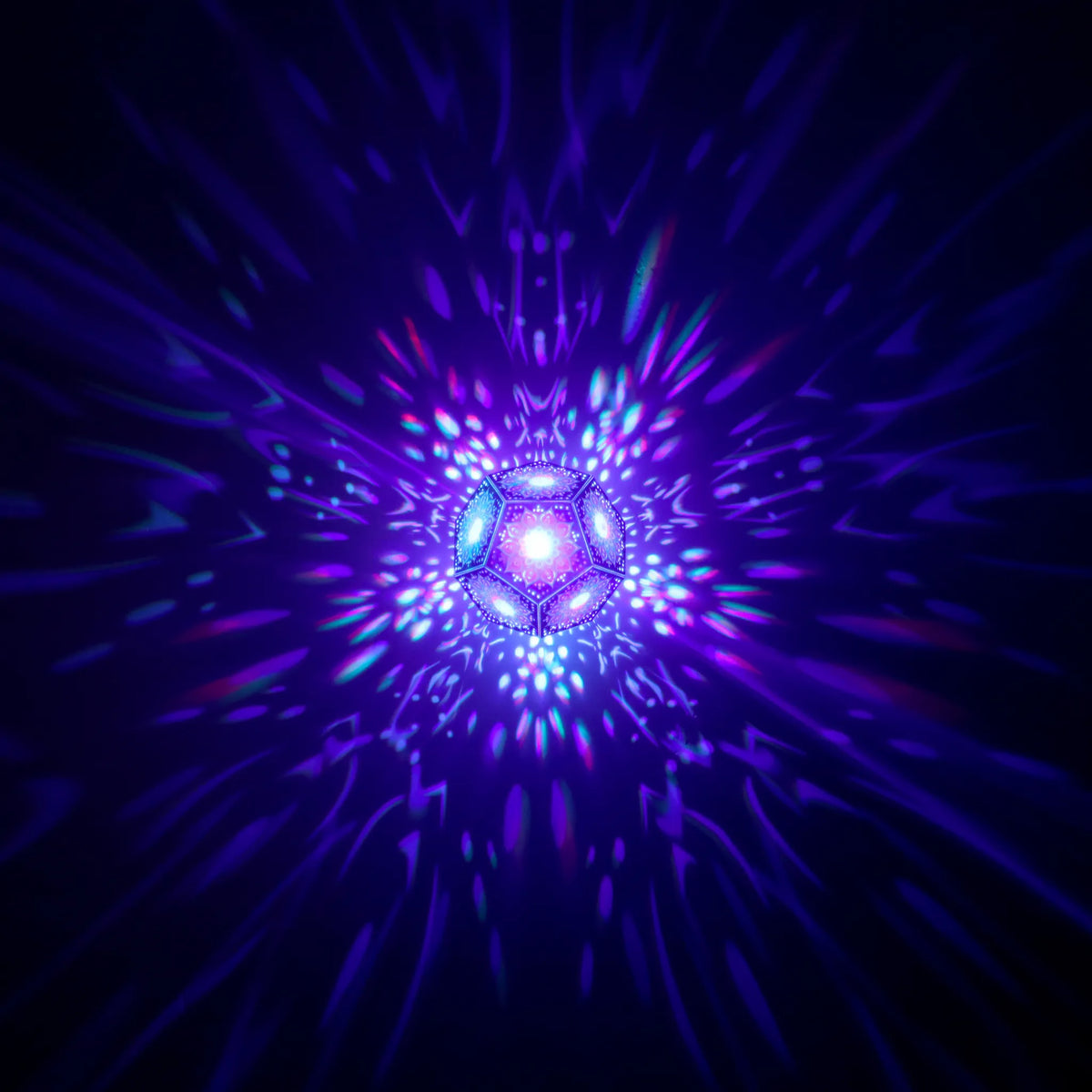 MikhaLuma Oneiros dodecahedron lantern in Shadow Caster style, geometric pattern projected across a wall