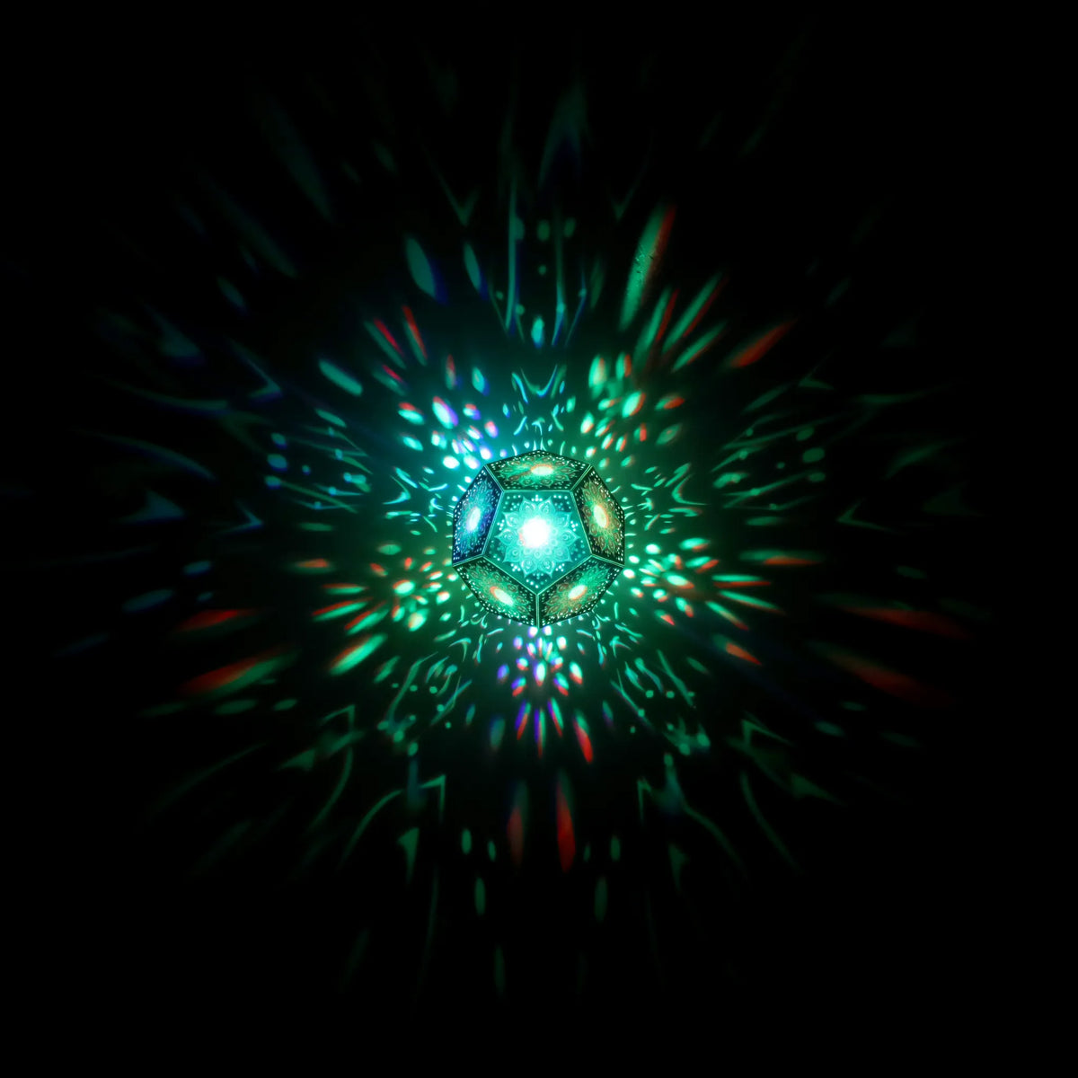 MikhaLuma Sophia dodecahedron lantern in Shadow Caster style, geometric pattern projected across a wall