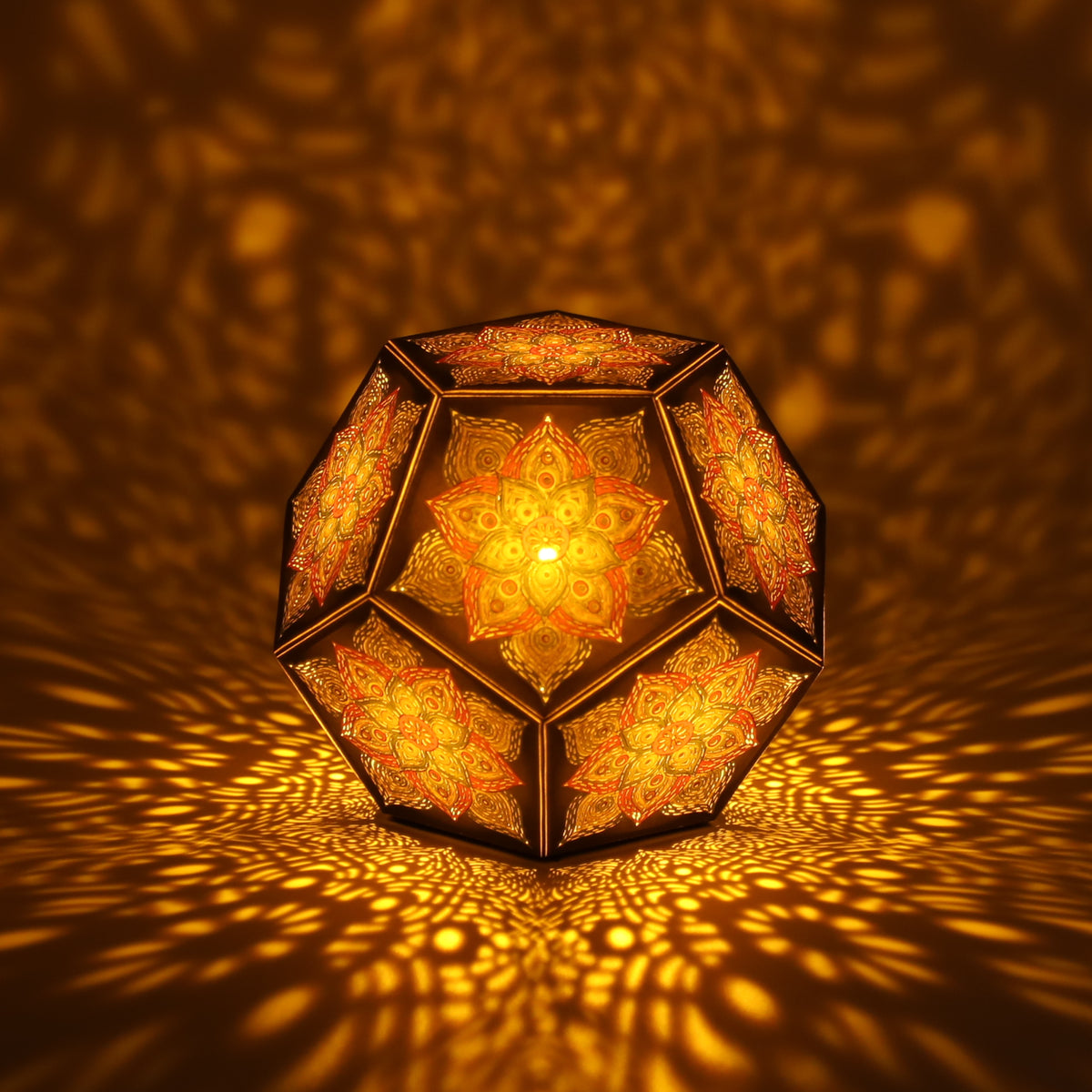 MikhaLuma Eros dodecahedron lantern in Amber style, lit with a warm amber tone