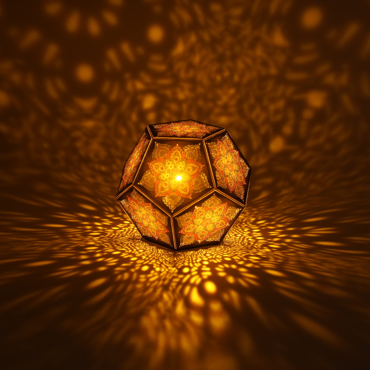 MikhaLuma Eros dodecahedron lantern in Amber style, lit with a warm amber tone