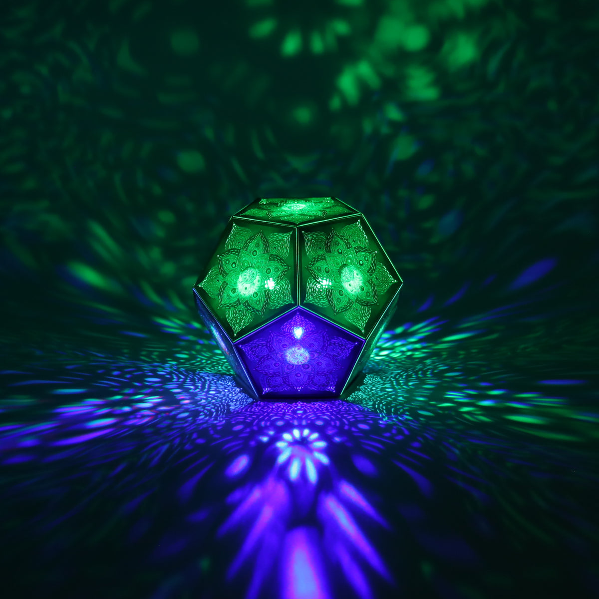 MikhaLuma Eros dodecahedron lantern in Shadow Caster style, casting geometric light patterns across a dark room