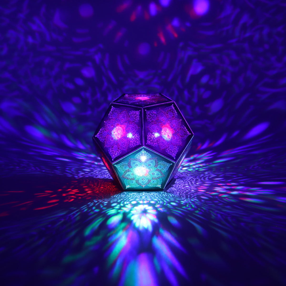 MikhaLuma Eros dodecahedron lantern in Shadow Caster style, casting geometric light patterns across a dark room