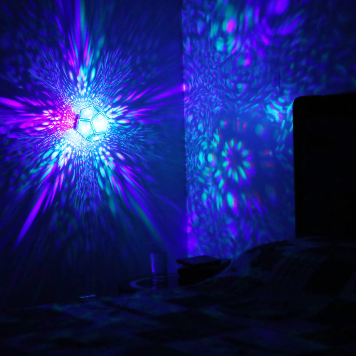 MikhaLuma Eros dodecahedron lantern in Shadow Caster style, projected pattern wrapping a wall corner