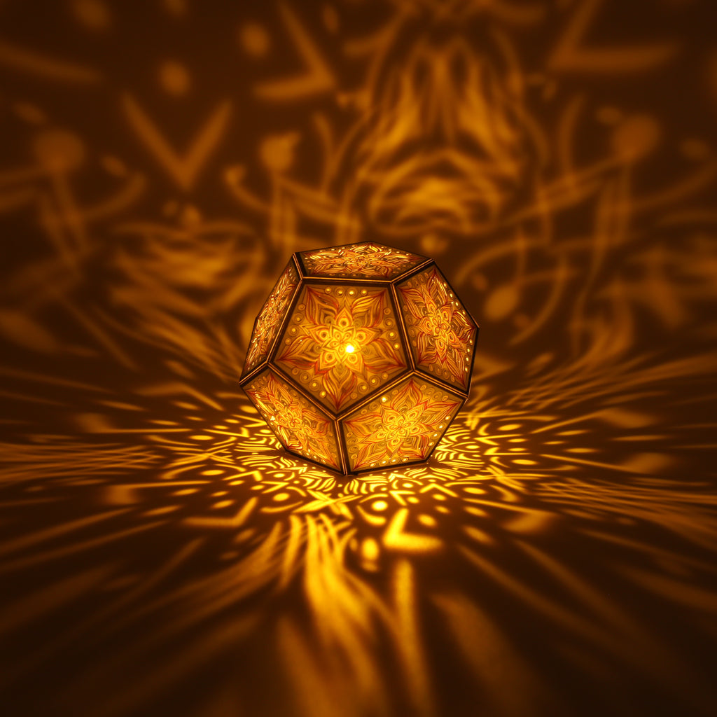 MikhaLuma Metanoia dodecahedron lantern in Amber style, lit with a warm amber tone