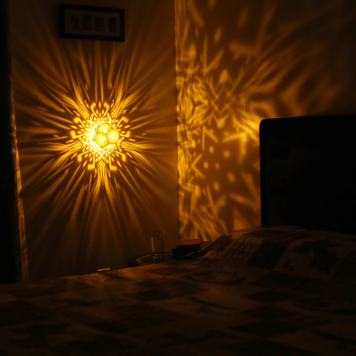 MikhaLuma Metanoia dodecahedron lantern in Amber style, warm amber light wrapping a wall corner
