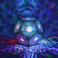 MikhaLuma Metanoia dodecahedron lantern in Shadow Caster style, casting geometric light patterns across a dark room