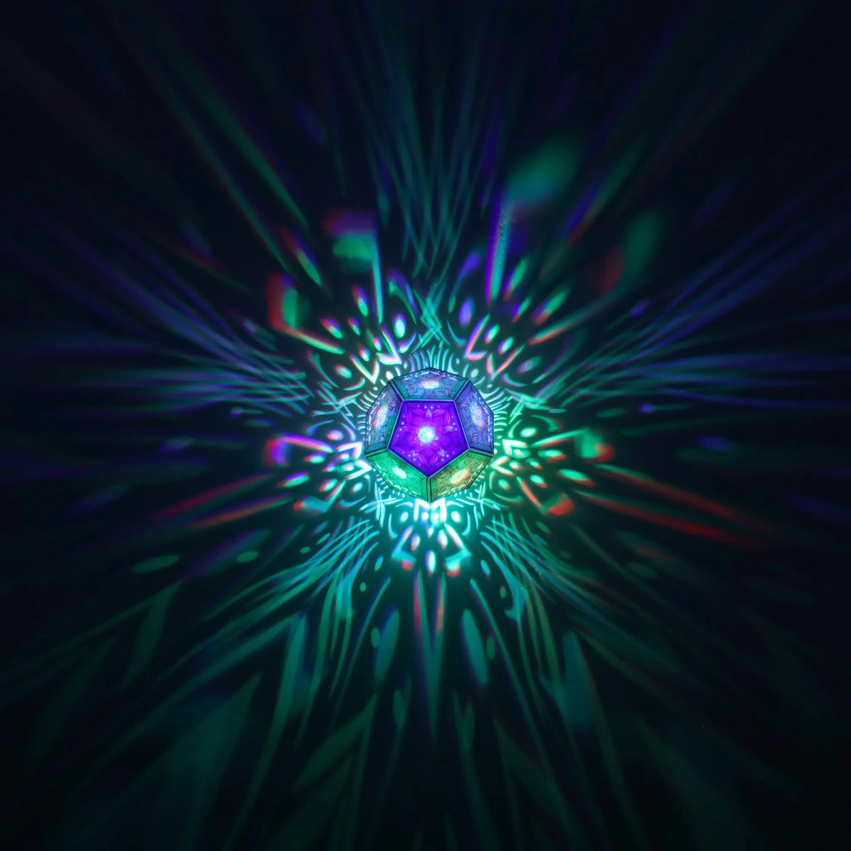 MikhaLuma Metanoia dodecahedron lantern in Shadow Caster style, geometric pattern projected across a wall