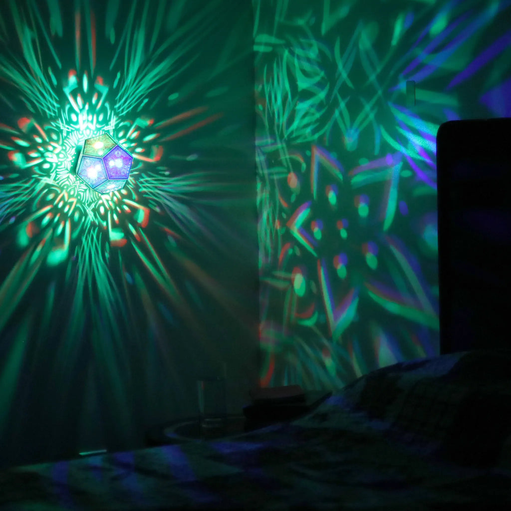 MikhaLuma Metanoia dodecahedron lantern in Shadow Caster style, projected pattern wrapping a wall corner