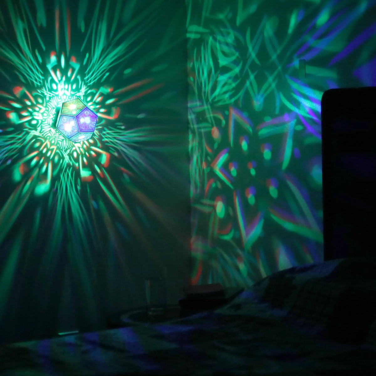 MikhaLuma Metanoia dodecahedron lantern in Shadow Caster style, projected pattern wrapping a wall corner