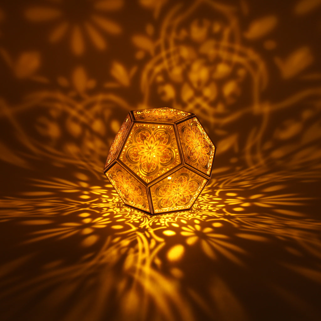MikhaLuma Agape dodecahedron lantern in Amber style, lit with a warm amber tone